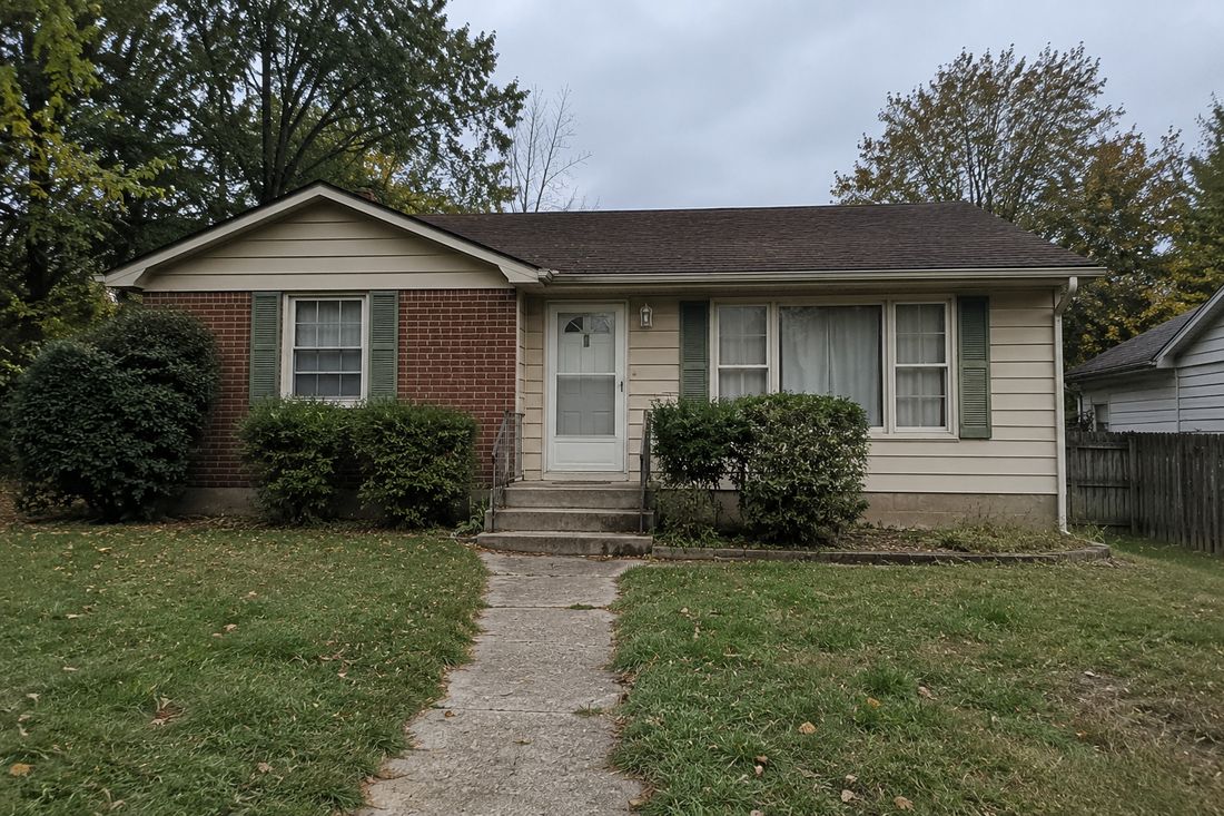 A brick ranch with a center entry
