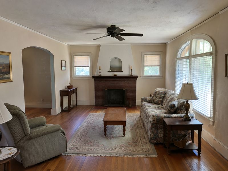 A living room kept just so, fireplace and all