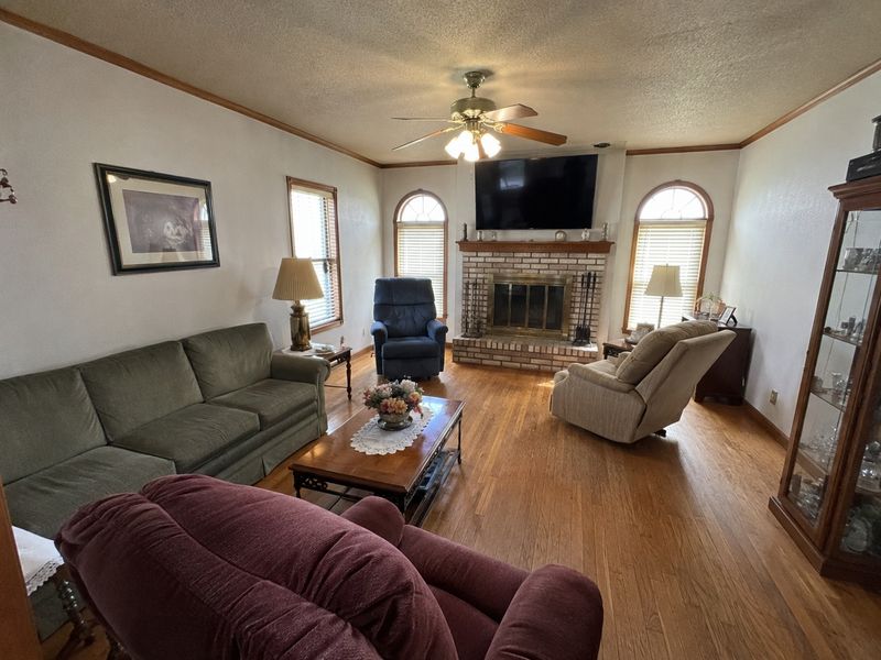 A full, lived-in living room, taken exactly as it is
