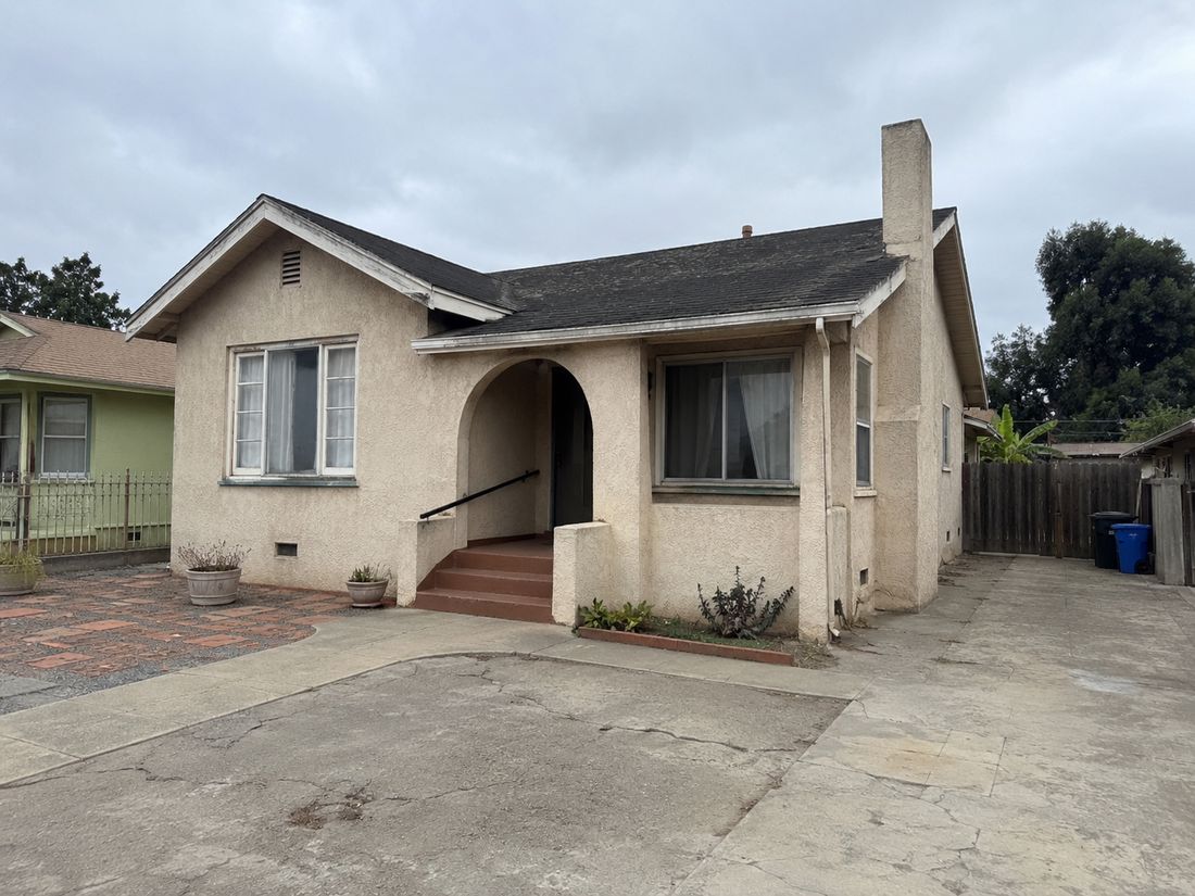 A small bungalow with a driveway