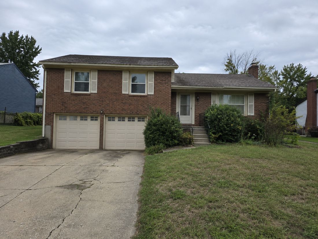 A split-level brick home with a garage